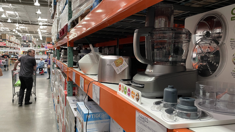 Shopper in Costco kitchen appliance aisle