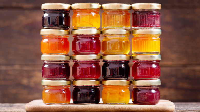 Assorted small jars of jams and honey
