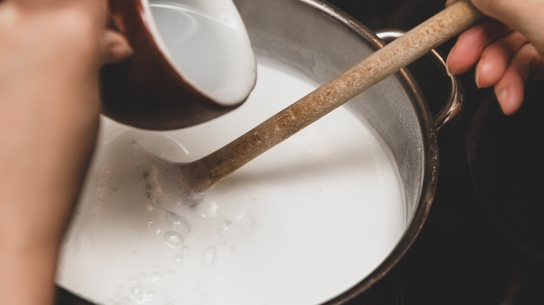 Milk being heated in pan