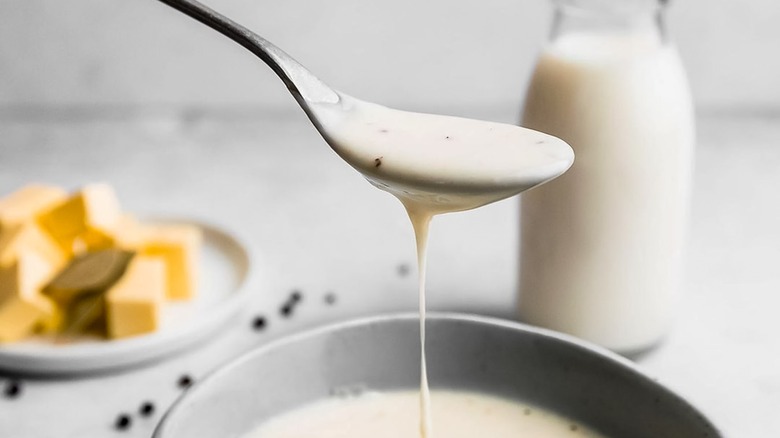 bechamel dripping from a spoon