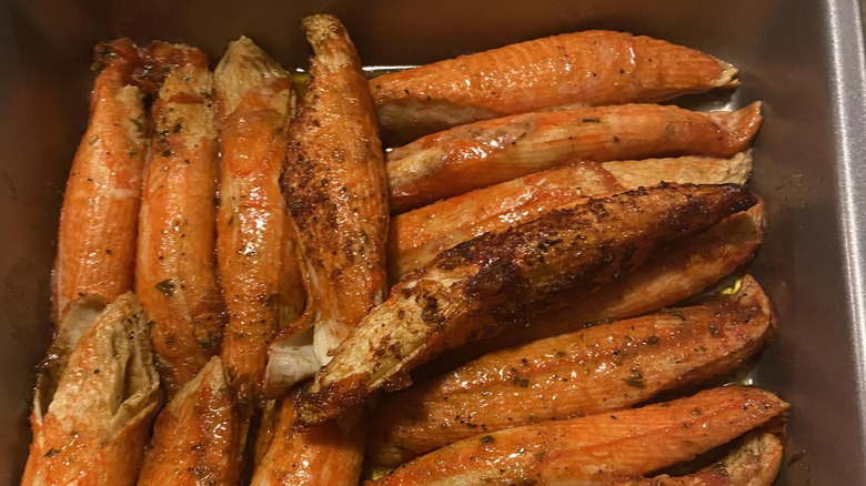 Sam's Club imitation crab legs rest in a pile in a roasting pan