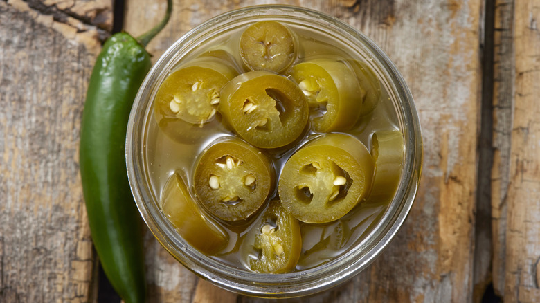 Candied jalapenos in mason jar