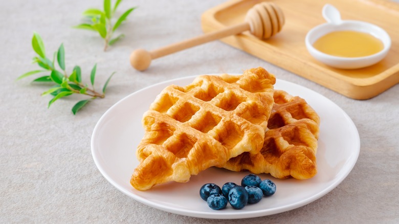 croffles on a plate with blueberries