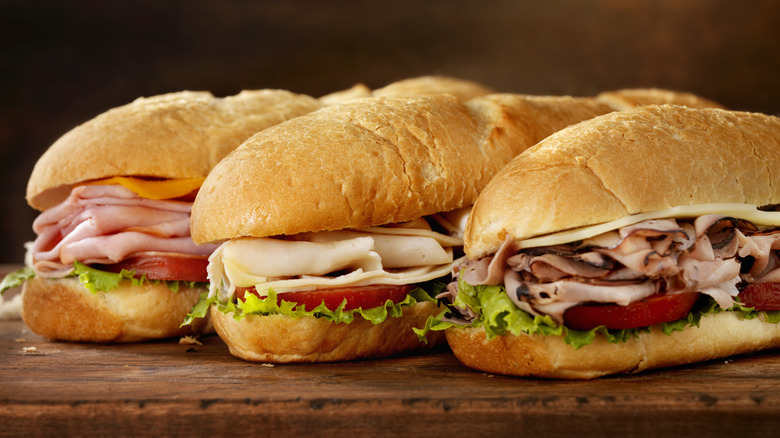 a trio of hoagie sandwiches