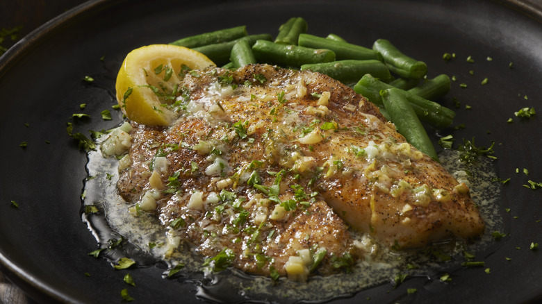 Baked tilapia with lemon, butter, spices, and green beans