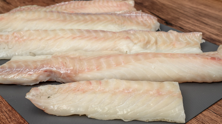 Fresh slices of raw cod tenderloin