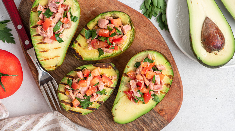 Grilled avocados stuffed with tuna and vegetables