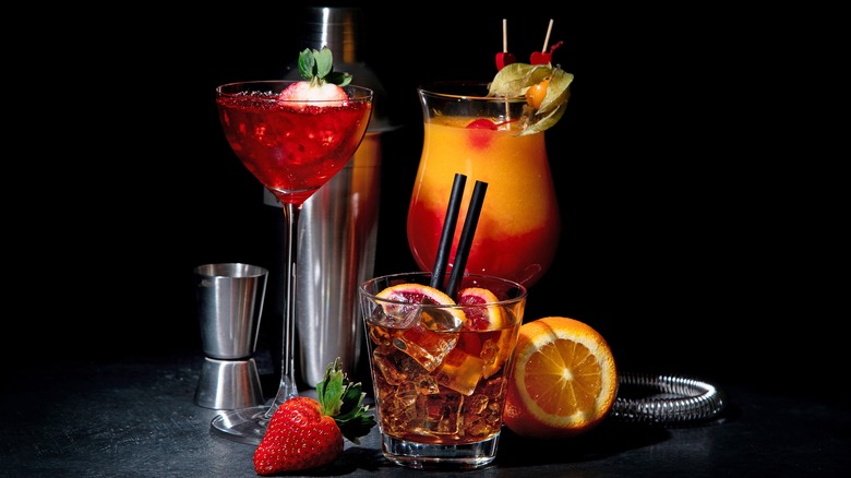 Assorted cocktails with straws
