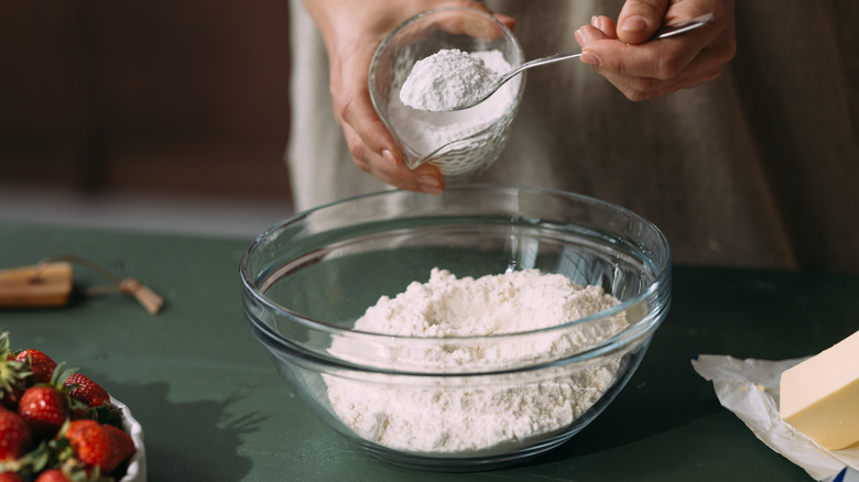 flour scooped into microwave-safe glass bowl