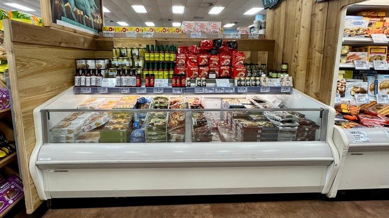 A Trader Joe's freezer cooler is filled with packages of food