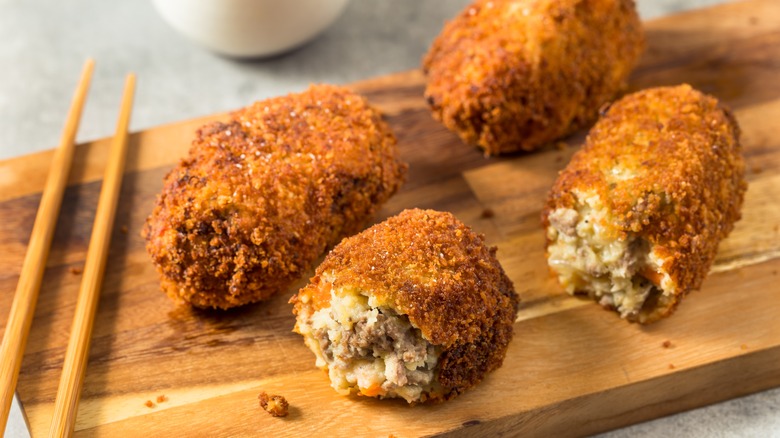 Japanese korokke beef croquettes on board