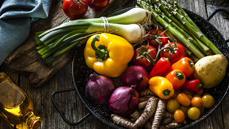 pan with colorful veggies and olive oil