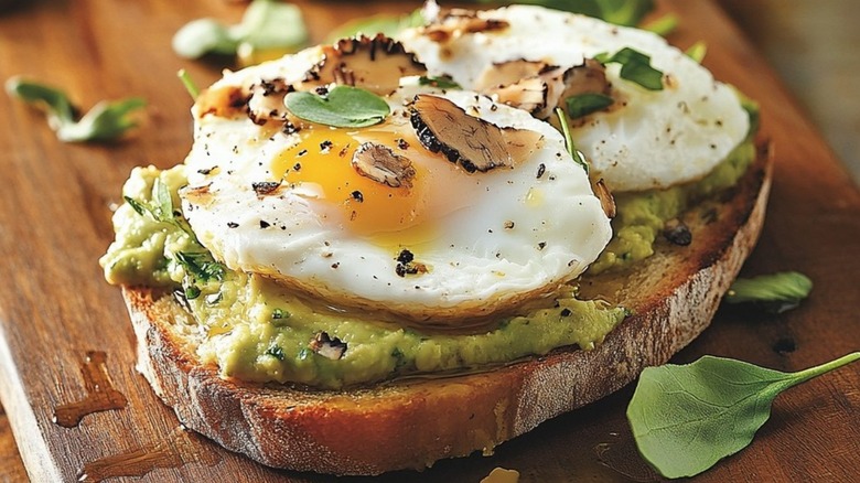 Avocado toast topped with a poached egg