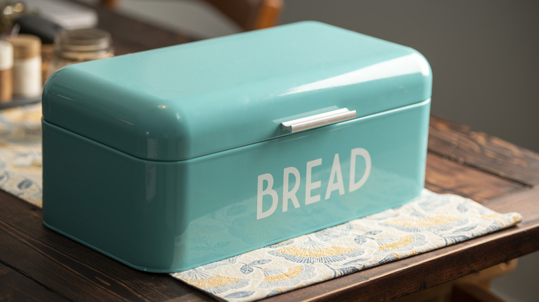 turquoise bread box labeled "BREAD"