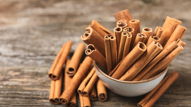 Cinnamon sticks in a bowl.