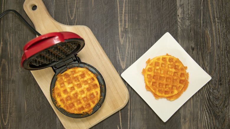 chaffles being made in a mini waffle maker
