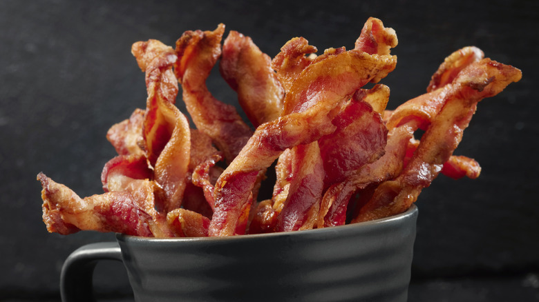 Cooked bacon twist spirals in serving cup