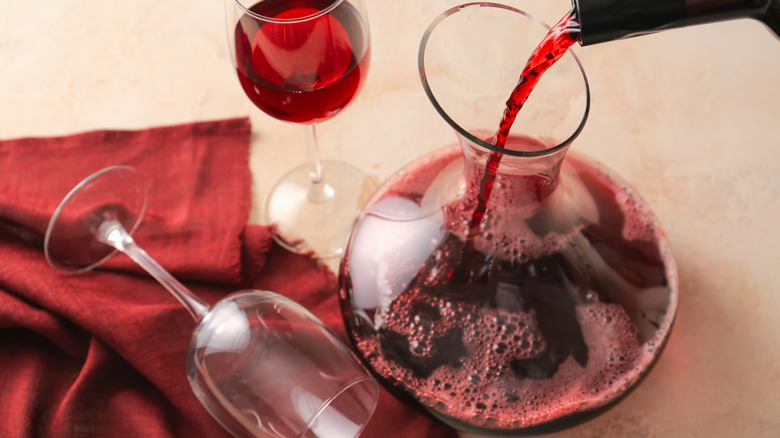 Pouring red wine in a decanter