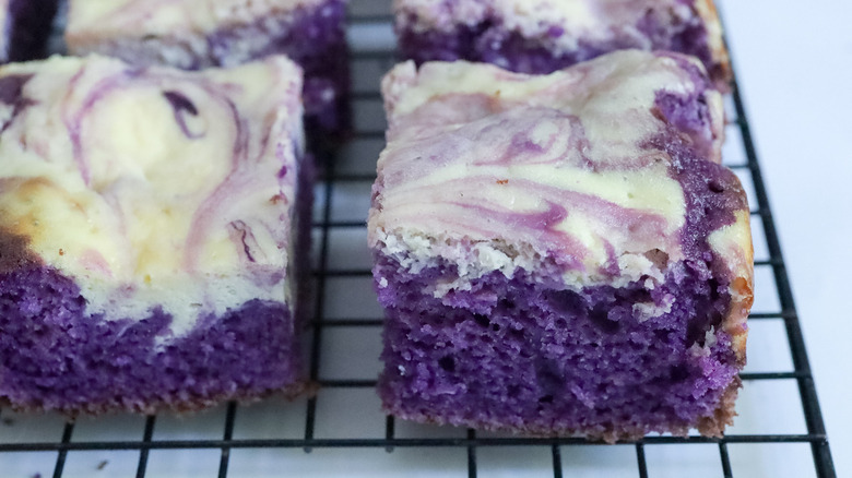 ube cheesecake brownies on rack