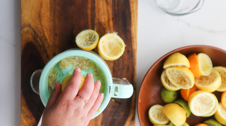 Hand juicing citrus fruit