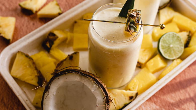 overhead of a glass of Pina Colada with coconut