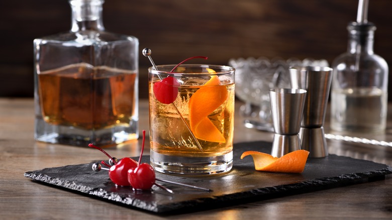 old fashioned drink with cherry and orange