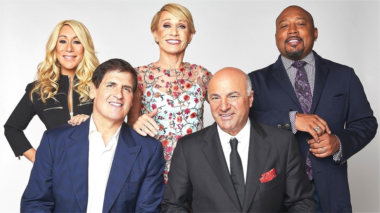 "Shark Tank" judges smiling in front of white backdrop