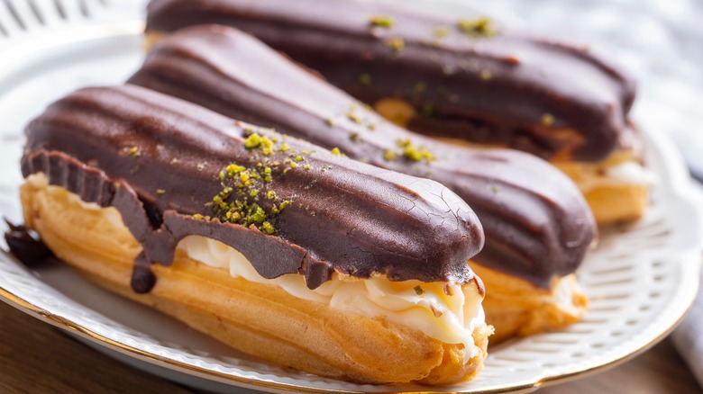 chocolate eclairs on a white plate