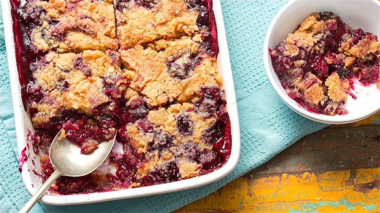 Mixed berry dump cake with spoon