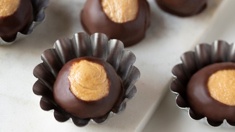 chocolate peanut butter Buckeye candies in foil cups