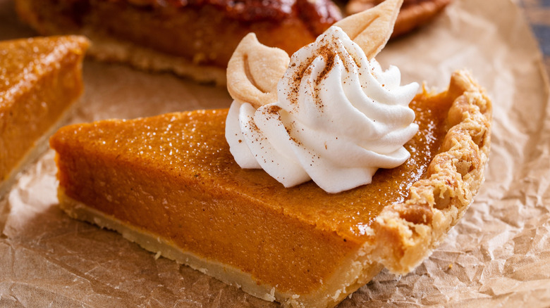 slice of pumpkin pie on parchment paper