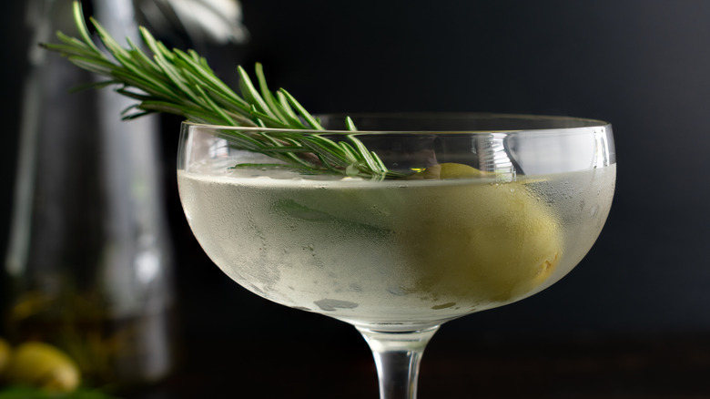 Martini with olive and herbs