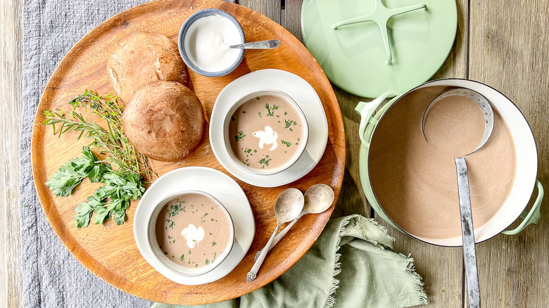 Porcini mushroom soup served on table