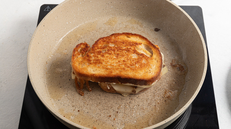 grilled cheese sandwich in pan