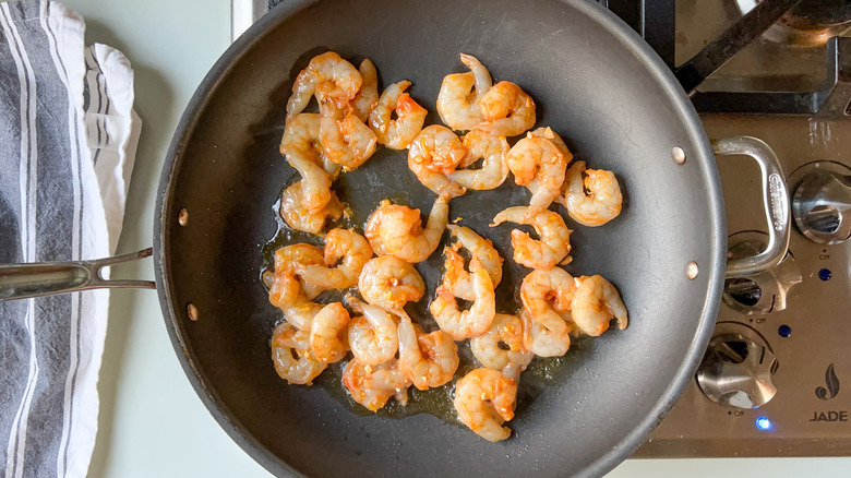 Shrimp cooking in skillet