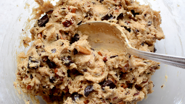 close-up of spoon mixing cookie dough