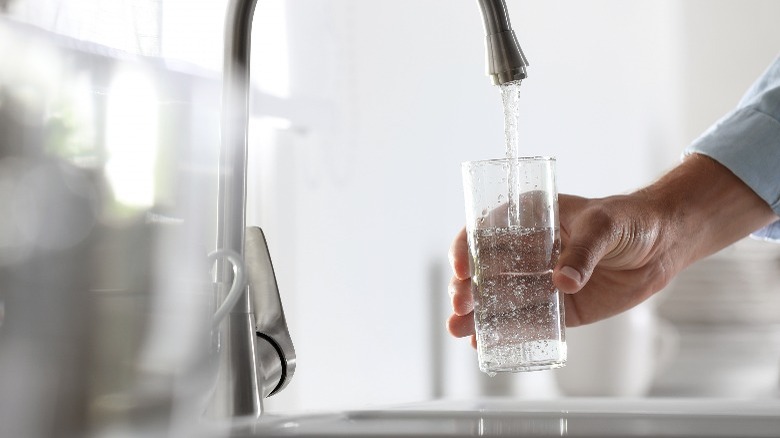 Pouring tap water in cup