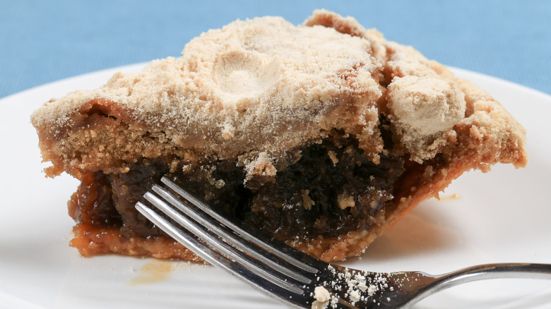 Slice of shoo fly pie with fork
