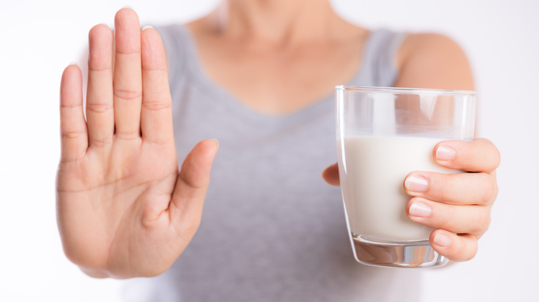 woman signaling no to milk