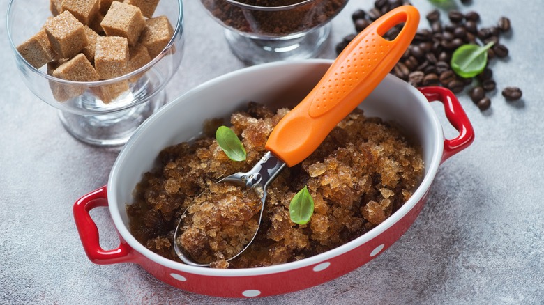 Dish of frozen coffee granita and ice cream scoop