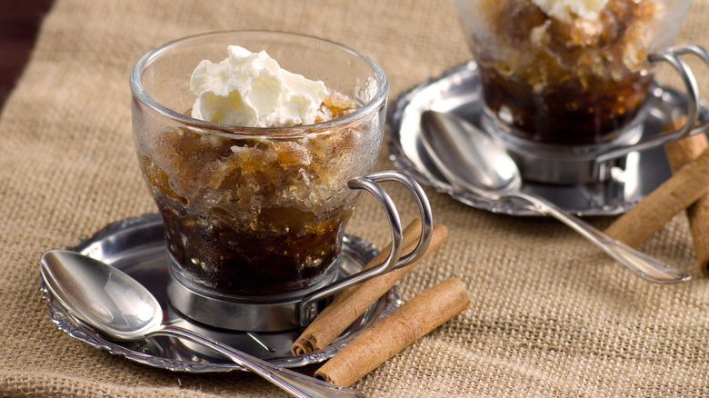 Coffee granitas with whipped cream and cinnamon sticks