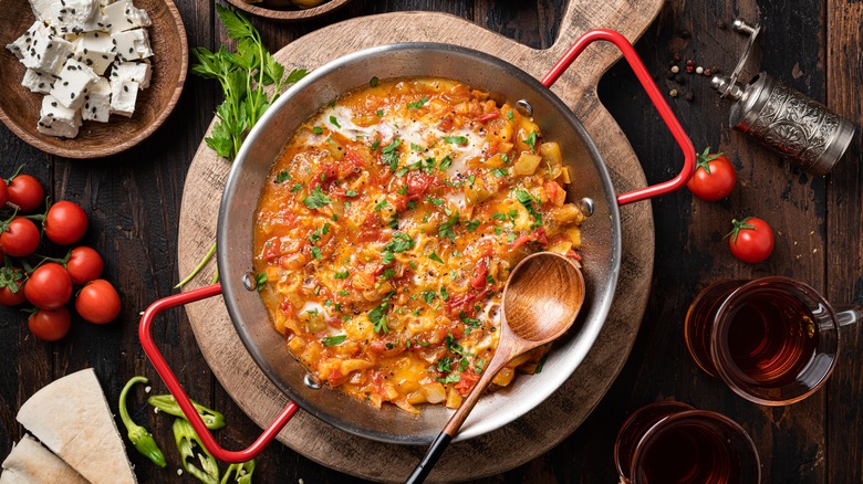 Menemen with a bowl of cheese and Turkish tea