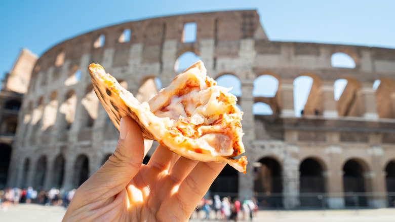 pizza slice near Roman Colosseum 