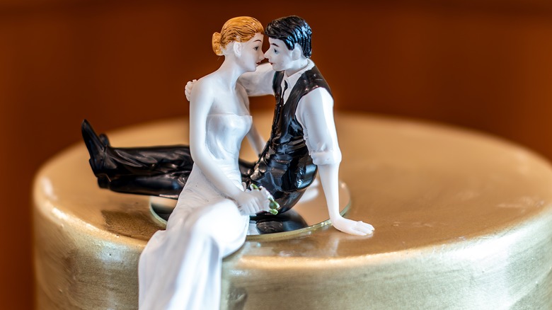 Kissing couple wedding topper