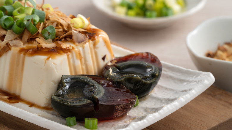 Century eggs alongside silken tofu