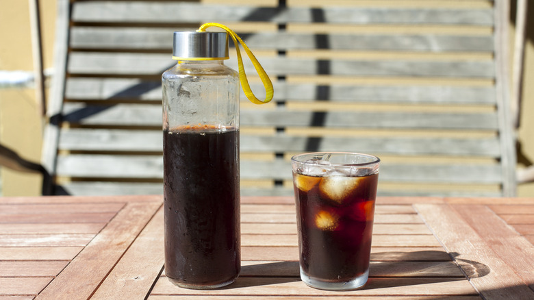 cold brew coffee in bottle and cup