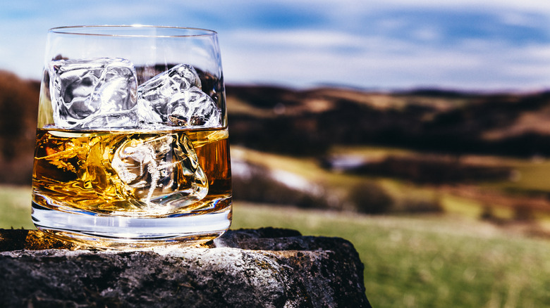 Glass of whisky in the Scottish Highlands