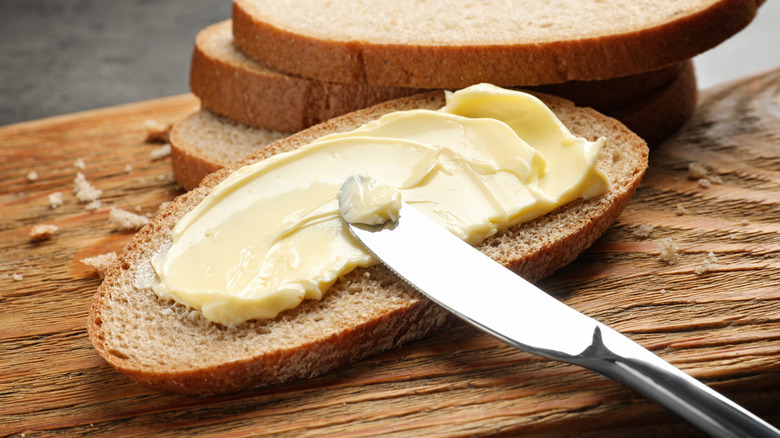 Butter spread on a slice of bread