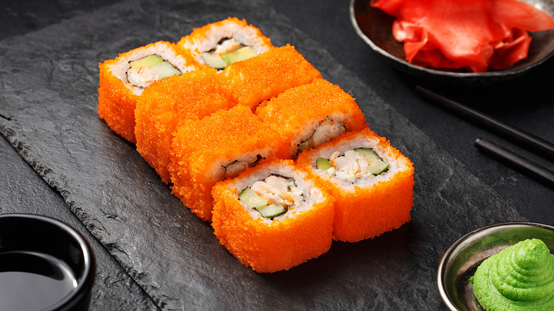 A plate of sushi covered in masago