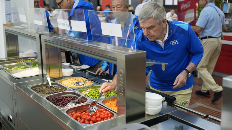 People serving themselves at Olympic Village dining hall